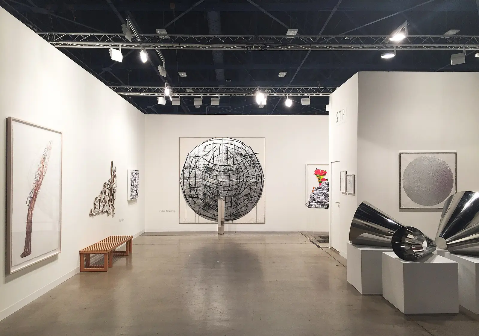 Gallery booth with large sculptures and framed works at Art Basel Miami Beach in 2014