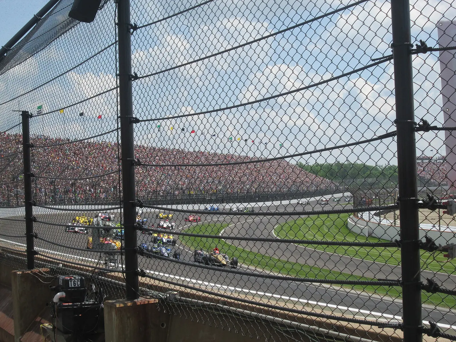 Cars racing at the Indianapolis Motor Speedway