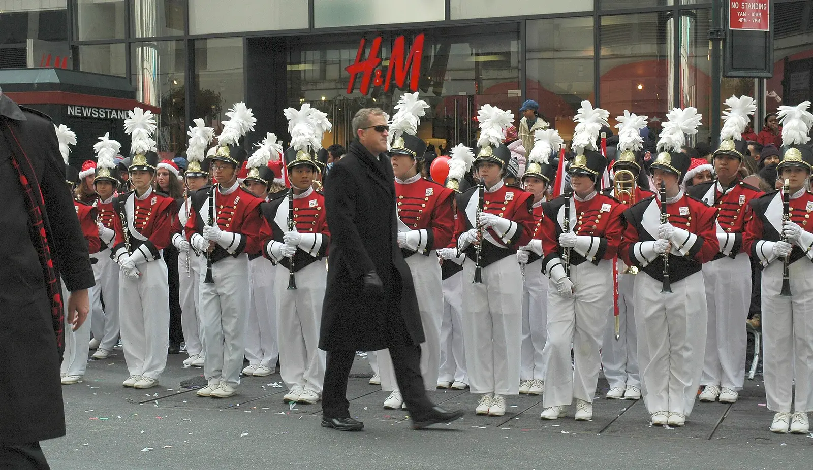 Marching band in red and white uniforms on a Manhattan street during the Macy's Thanksgiving Day Parade in 2005