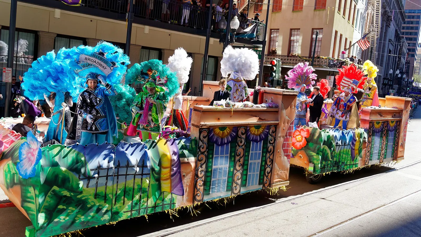 Colourful Krewe of Iris float with feathered costumes at the 2017 New Orleans Mardi Gras parade