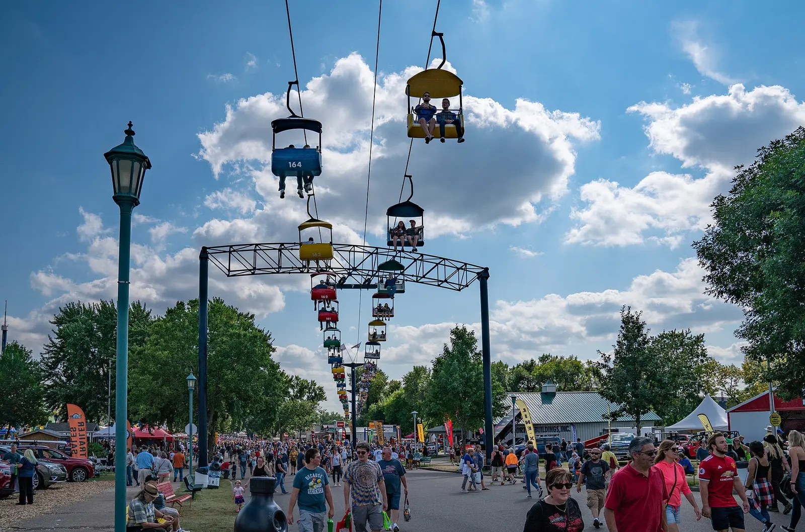 Crowds walking beneath the Skyride gondolas at the Minnesota State Fair