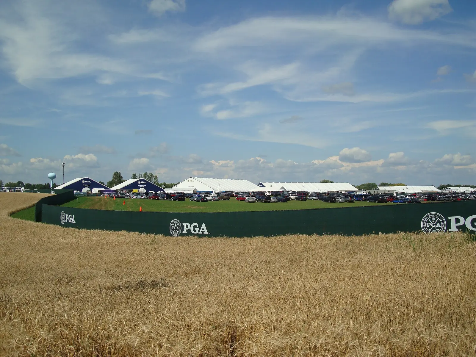 Spectator tents and PGA Championship boundary signage beside the course at the 2009 PGA Championship