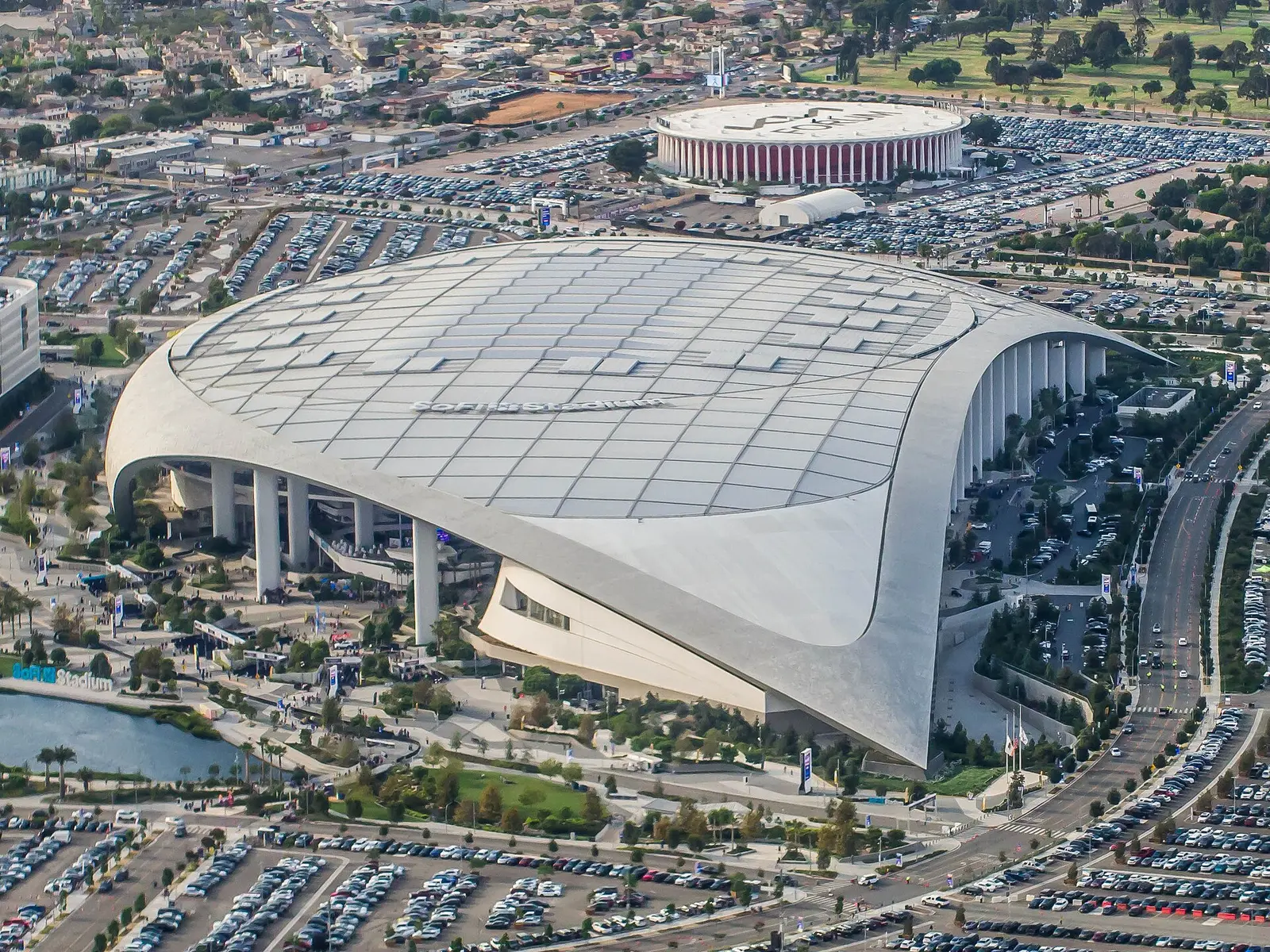 Aerial view of SoFi Stadium with its translucent canopy roof in Inglewood, Los Angeles