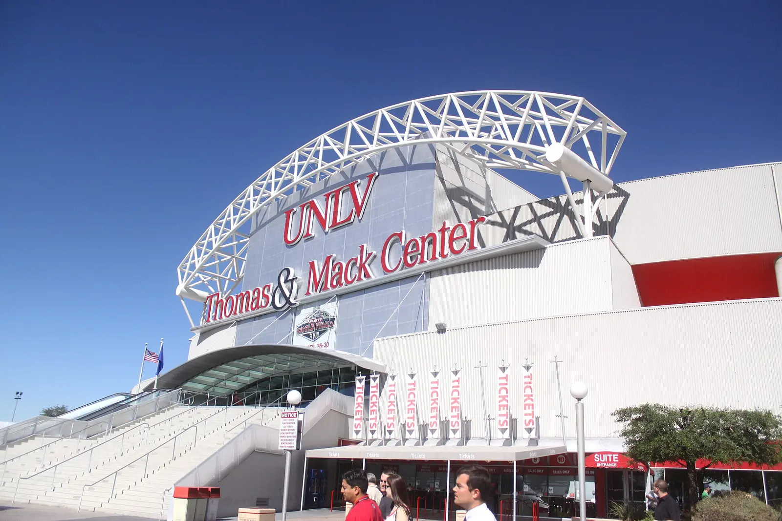 Entrance arch of the Thomas and Mack Center arena in Las Vegas under a blue sky